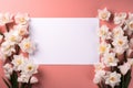 mockup white blank paper sheet with daffodil flowers top view on pink background, floral template empty card flat lay for design