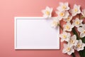 mockup white blank paper sheet with daffodil flowers top view on pink background, floral template empty card flat lay for design