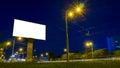 Mockup white empty screen billboard on highway with traffic Royalty Free Stock Photo