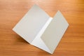 Mockup of white opened three fold brochure business on wooden Royalty Free Stock Photo