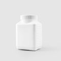 Mockup of a white plastic square jar for vitamins  tablets  supplements  for design presentation  advertising in medicine Royalty Free Stock Photo