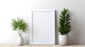 Mockup white poster frame close up on white wall with green plants. Minimalistic Frame Mock up Royalty Free Stock Photo