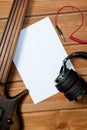 Mockup with a white sheet of paper with a guitar and headphones for music themes and drawings