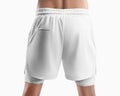 Mockup of white sports shorts with underpants compression line, back view, sports undershorts on a man, for design, pattern Royalty Free Stock Photo