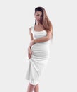 Mockup of a white tight dress, on a girl, beautifully straightening her clothes, isolated on background, front view, close-up