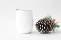 Mockup - white wine tumbler with big pine cone Royalty Free Stock Photo