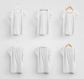 Mockup of white womens t-shirt hanging on a plastic, fabric and wooden hanger, blank clothes for design presentation Royalty Free Stock Photo