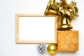 Mockup of wooden frame with golden and silver christmas decorations, ball, bells, present Royalty Free Stock Photo