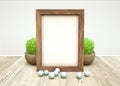 Mockup of wooden frame, pearls, green succulent plant in ceramic on wooden table Royalty Free Stock Photo