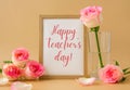 Mockup Wooden frame with text HAPPY TEACHERS DAY on delicate pink roses on beige background. Minimal trendy composition