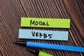 Modal Verbs write on sticky notes isolated on office desk Royalty Free Stock Photo