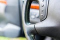 Mode button on leather steering wheel, shallow depth of field