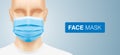 Asian man wearing a blue surgical face mask.