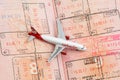 Airberlin aircraft on the opened Passport with visa stamps Royalty Free Stock Photo
