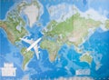 Model aircraft flying over world map Royalty Free Stock Photo