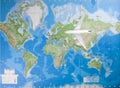 Model airplane flying over world map Royalty Free Stock Photo