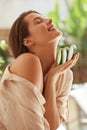 Model With Aloe Vera Portrait. Happy Woman With Naked Shoulders Holding Fresh Juicy Slices Of Leaf. Royalty Free Stock Photo