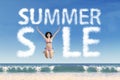 Model at beach with summer sale cloud Royalty Free Stock Photo