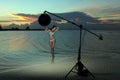 Model in bikini with coral necklace posing on the empty beach Royalty Free Stock Photo