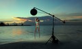 Model in bikini with coral necklace posing on the empty beach Royalty Free Stock Photo