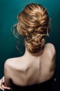 Model blonde Woman with perfect hairstyle and creative hair-dress, back view.