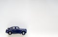 Model of a blue vintage children`s car on white isolate, place for text Royalty Free Stock Photo