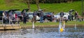Model boat club members with model yachts on lake in Warminster, Wiltshire, UK