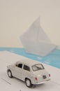 Model car (toy) on the road overlooking the ship Royalty Free Stock Photo