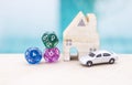 Model car with wooden miniature house and dice divination on blurred background Royalty Free Stock Photo