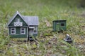 A model of a Russian country house with a barn and a well. Royalty Free Stock Photo