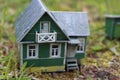 A model of a Russian country house with a barn and a well. Royalty Free Stock Photo