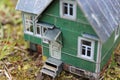 A model of a Russian country house with a barn and a well. Royalty Free Stock Photo