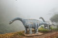 Model of Chiang Muang dinosaur with mist at Phayao province