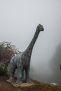 Model of Chiang Muang dinosaur with mist at Phayao province