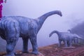 Model of Chiang Muang dinosaur with mist at Phayao province