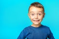 A model child posing on turquoise background