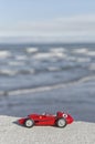 Model of a classic red car over the sea Royalty Free Stock Photo
