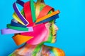 Model with colorful abstract makeup in multicolored helmet