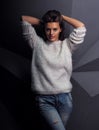 Model cute female brunette at the techno geometry wall background Royalty Free Stock Photo