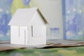 Model of detached house and European Union money Royalty Free Stock Photo
