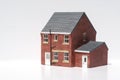 Model of detached house on white background