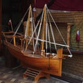 Model dhow and Qatari flag