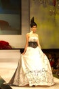 A model displays a creation by Dominique Chan