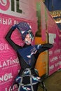 Model in an extravagant black suit in the photo zones at the festival of beauty Nevskie Berega in St. Petersburg