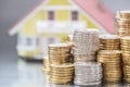 Model familly house with coins as bank or insurance concept