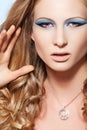 Model with fashion make-up, long hair and jewelry Royalty Free Stock Photo
