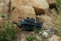 Radio control army tank on rock