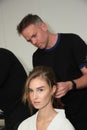 A model getting ready backstage before the Reem Acra Bridal show Fall/Winter 2018 Collection Royalty Free Stock Photo