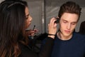 A model getting ready backstage at the SERGIO DAVILA fashion show during Mercedes-Benz Fashion Week Fall 2015 Royalty Free Stock Photo