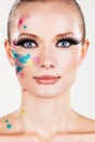 Model girl with fake eyelashes colourful glittery makeup stars - Abstract art